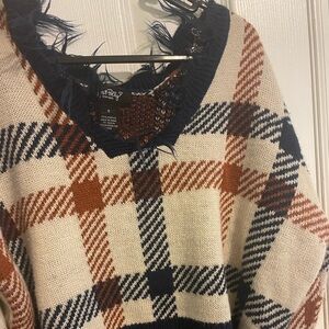 distressed off the shoulder sweater